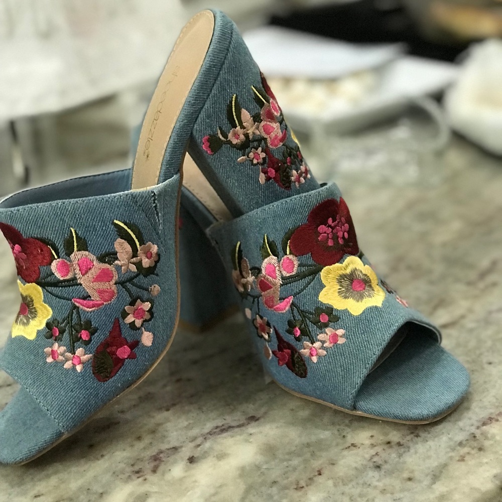 Women’s slip on floral and denim heals.